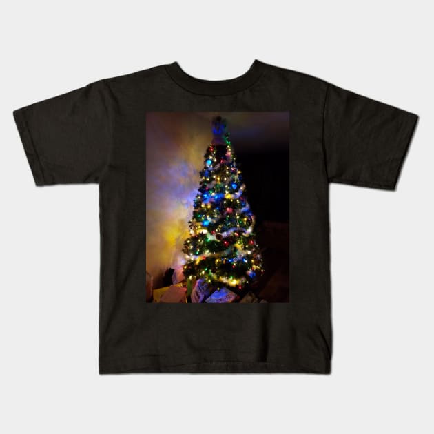 Christmas tree lit for the night Kids T-Shirt by Kim-Pratt